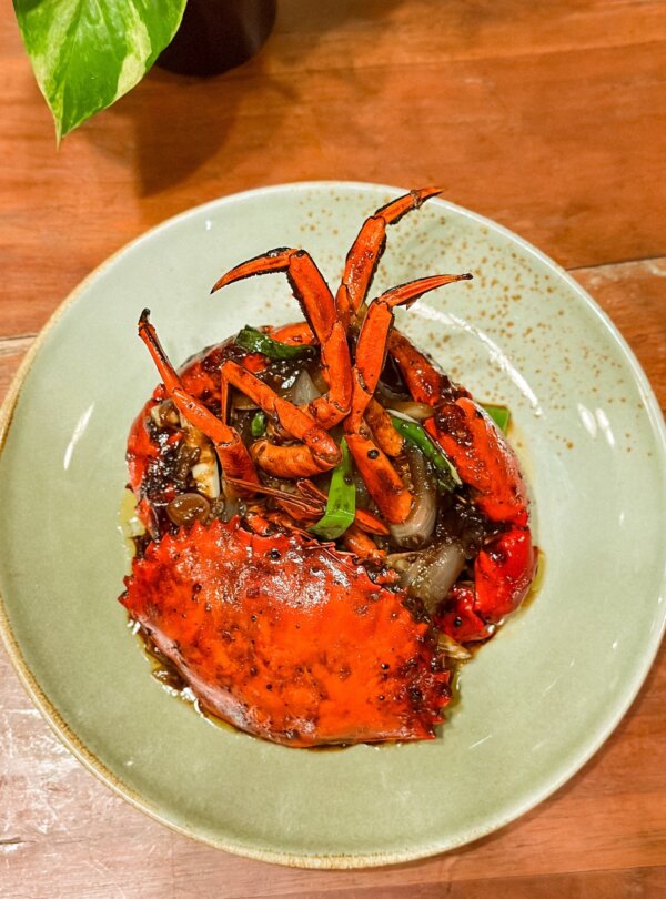 Cozy dining area of Artomoro Restaurant serving Indonesian and seafood specialties in Labuan Bajo, Flores