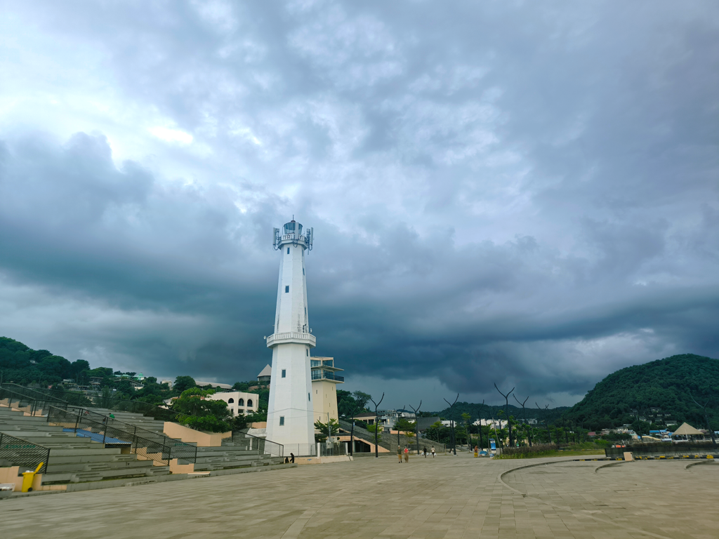 Scenic view of boats and yachts docked at Marina Waterfront Labuan Bajo with hills in the background